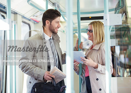 Business people talking on train