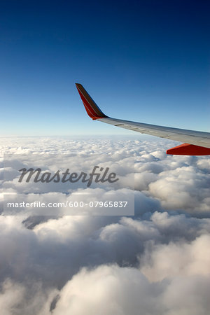 View from Window of Southwest Airlines Jet while Flying over Clouds View from Window of Southwest Airlines Jet while Flying over Clouds
