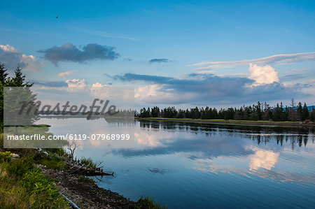 Clouds reflecting in the water at Jersey Cove, Cape Breton Highlands National Park, Cape Breton Island, Nova Scotia, Canada, North America