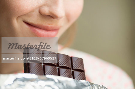 Woman eating a chocolate