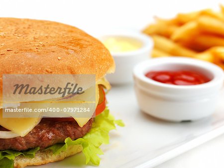 still life with fast food hamburger menu, french fries, soft drink and ketchup