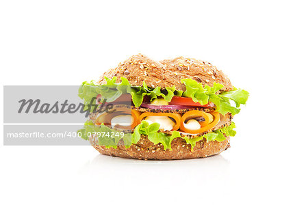 Fresh wheat sandwich with fresh vegetable ham and cheese isolated on white background.