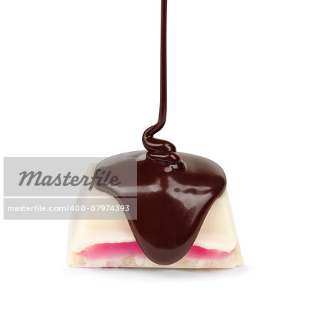 dark chocolate is poured onto a piece of white chocolate with pink stuffed stuffing