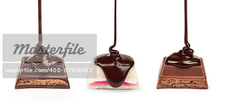 dark chocolate is poured onto a piece of white chocolate with pink stuffed stuffing