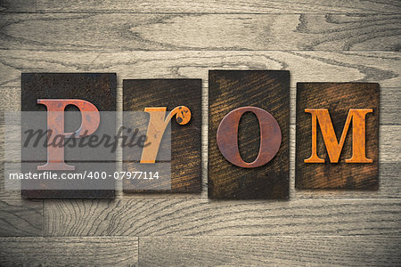 The word "PROM" written in wooden letterpress type.