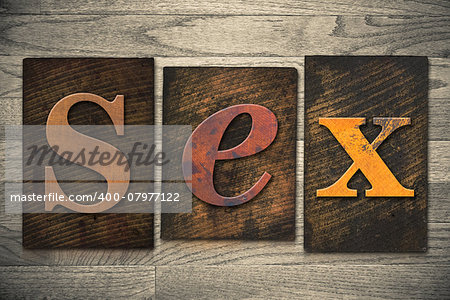 The word "SEX" written in wooden letterpress type.