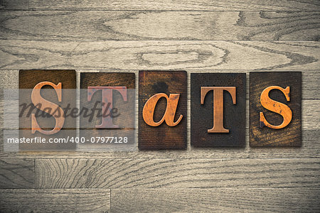 The word "STATS" written in wooden letterpress type.