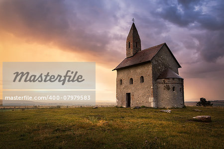 Old Roman Catholic Church of St. Michael the Archangel on the Hill at Sunset in Drazovce, Slovakia