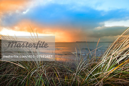 a beautiful view from the sand dunes of Beal beach and sunset in county Kerry Ireland