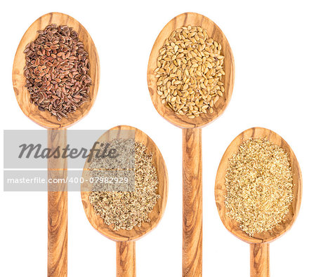 gold and brown flax seed and meal - isolated collection of wooden spoons