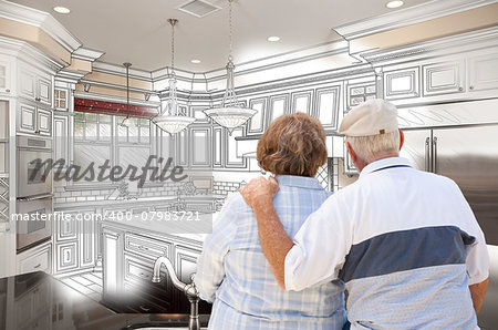 Senior Couple Looking Over Custom Kitchen Design Drawing and Photo Combination.