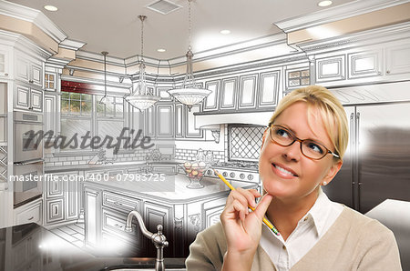 Creative Woman With Pencil Over Custom Kitchen Design Drawing and Photo Combination on White.