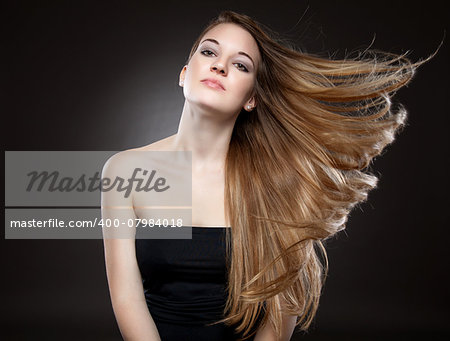 Beautiful woman with strong long brown hair
