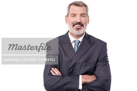 Senior business person with crossed arms