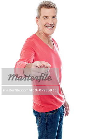 Smiling aged man pointing at you, isolated on white