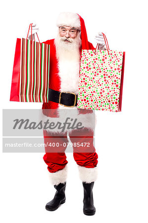 Cheerful santa claus shopping for x-mas gifts