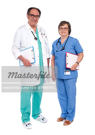 Senior male doctor posing with female nurse. Full length shot