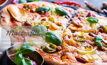 tasty pizza on a black background close up