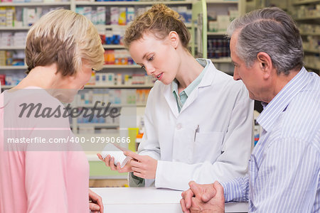 Pharmacist and sick customer speaking in the pharmacy
