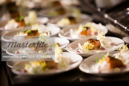 Salmon Dinners ready to be Served at Wedding Reception Salmon Dinners ready to be Served at Wedding Reception