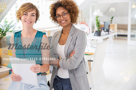 Portrait of two smiling office workers