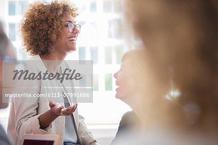 Office workers talking at meeting Office workers talking at meeting