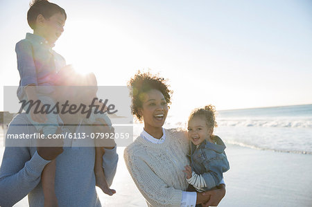 Happy family having fun on beach