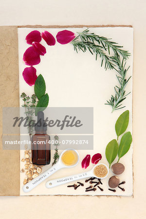 Pagan love potion ingredients over natural hemp notebook and mottled cream paper background.