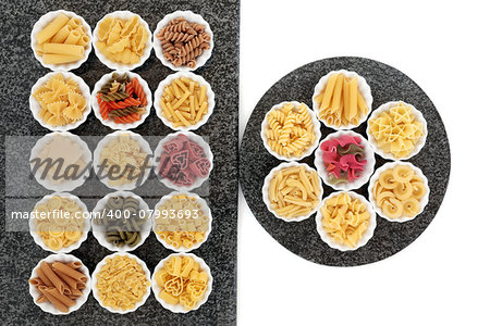Pasta dried food selection in porcelain crinkle bowls on marble rectangle and round slabs over white background.