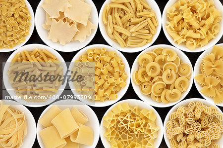 Pasta dried food selection close up in white porcelain bowls