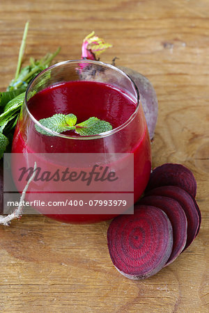 fresh beet juice with mint leaf in a glass