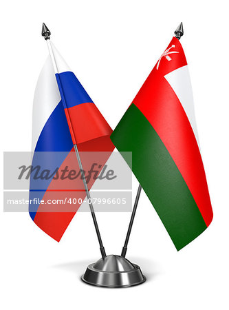 Russia and Oman - Miniature Flags Isolated on White Background.