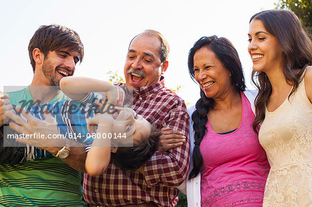 Three generation family in garden