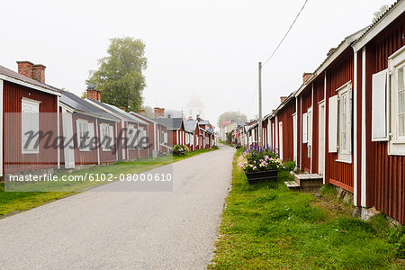 Country road along wooden houses