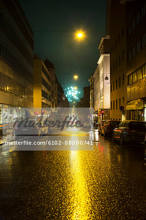 City street at night, fireworks on background