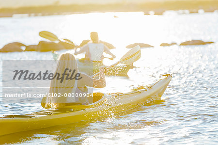 Women kayaking at evening