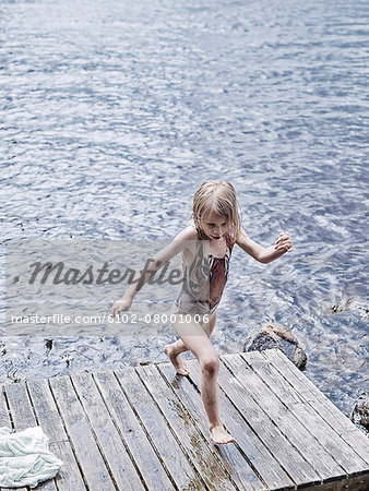 Girl running on jetty