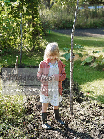 Girl standing in garden