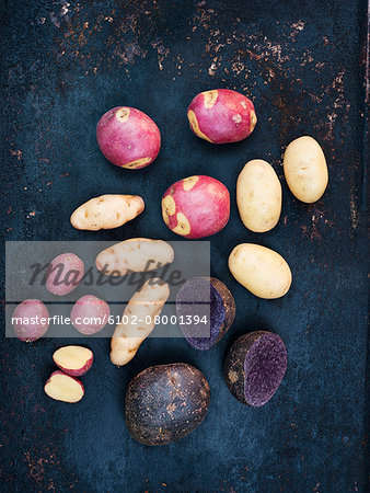 Various potatoes on blue background