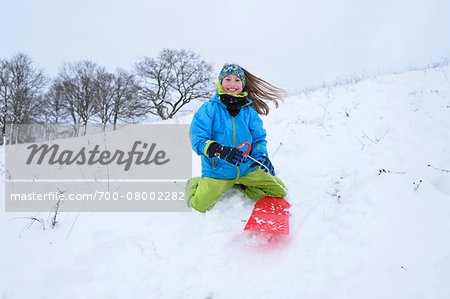 Girl Playing Outdoors in Snow, Upper Palatinate, Bavaria, Germany