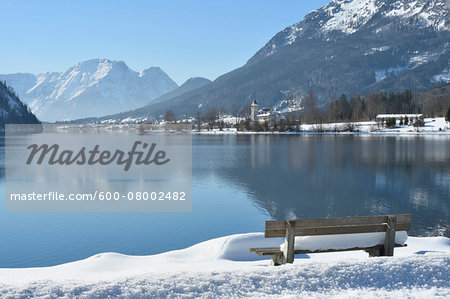 Landscape of Bench Full of Snow next to Lake Grundlsee in Winter, Styria, Austria Landscape of Bench Full of Snow next to Lake Grundlsee in Winter, Styria, Austria