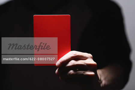Man holding red card