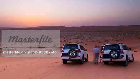 Four wheel drive vehicles in the desert; Liwa Oasis, Abu Dhabi, United Arab Emirates