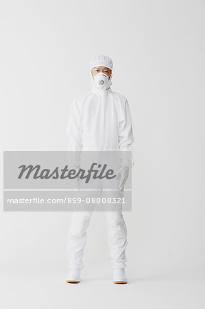 Young Japanese man in a protective suit