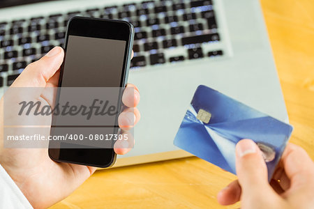 Man using smartphone for online shopping in close up