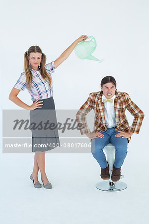 Geeky hipster watering her boyfriend on white background