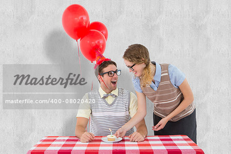 Geeky hipster couple celebrating his birthday  against white background