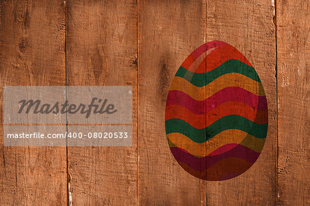 easter egg against wooden planks