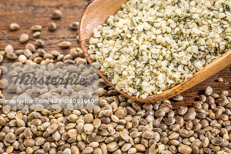 hemp seeds and hearts in a rustic wooden scoop