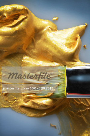 Close-up of Paint Brush in Gold Paint, Studio Shot